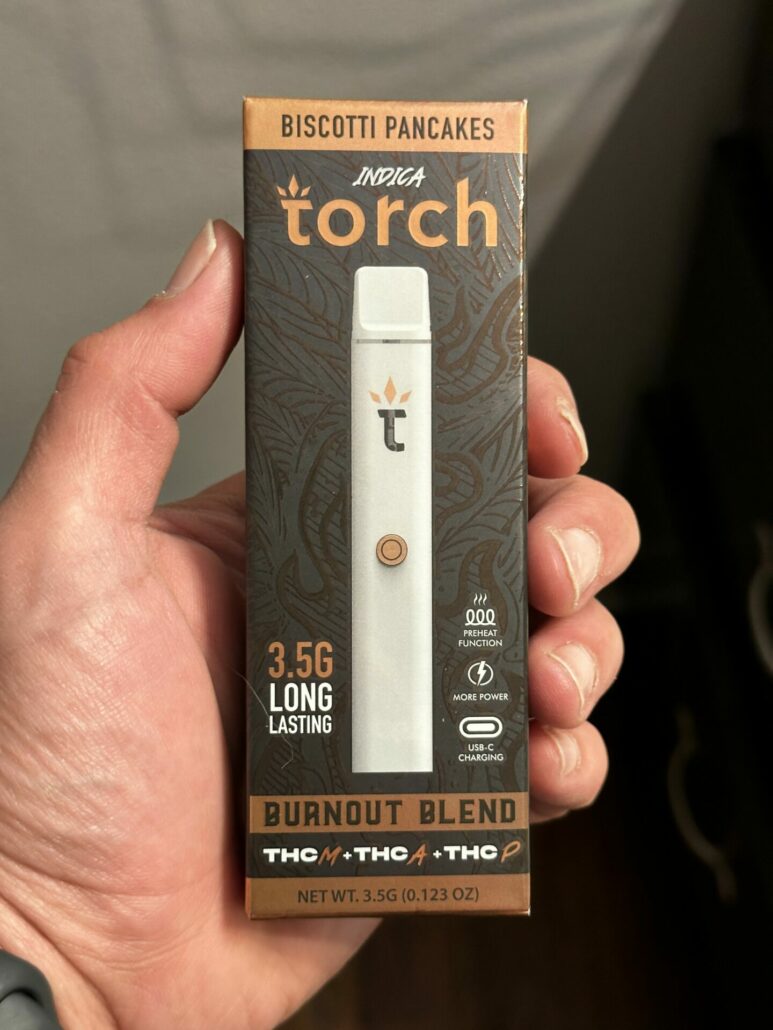 A photo of the front of the product box showing the Torch logo and product name in gold letters on a brown background.