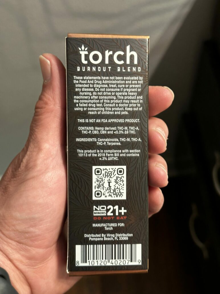 A photo of the back of the product box showing a list of ingredients, usage instructions, and a barcode.